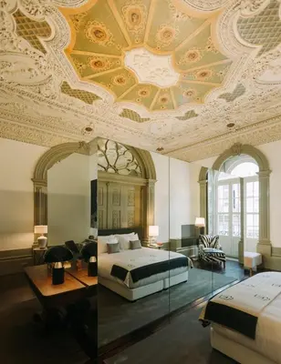 a bedroom with a bed and a coffered ceiling at Torel Palace Porto in Porto
