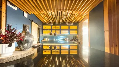 a kitchen with yellow cabinets and a vase on a counter at PipaD'oro by YoursPorto in Porto