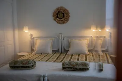 a bedroom with a bed with two pillows on it at Domus Duorum in Porto