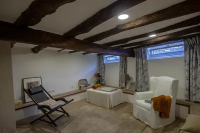 a living room with two chairs and a table at Domus Duorum in Porto