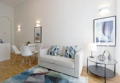 a living room with a couch and a table at HM - Oporto Cedofeita 500B in Porto