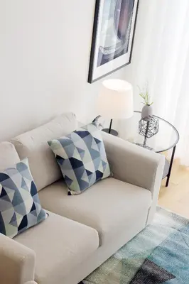 a living room with a couch and a table at HM - Oporto Cedofeita 500B in Porto