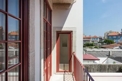 a view from the balcony of a house with red windows at HM - Oporto Cedofeita 500E in Porto