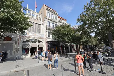 a group of people standing on a street in front of a building at FLH Sá da Bandeira Luxury Apartment in Porto