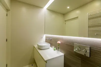 a bathroom with a sink and a mirror at Casa São Lázaro- Terrace by Oporto Soul in Porto