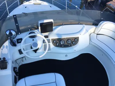 a white boat with a steering wheel and a dashboard at Cozy room with lake view in Porto 12 m² and terrace in Porto