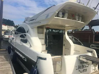 a white boat is docked at a dock at Cozy room with lake view in Porto 12 m² and terrace in Porto