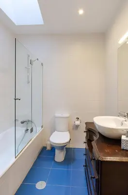 a bathroom with a toilet and a sink and a tub at Porto Gaia City House by MP in Vila Nova de Gaia