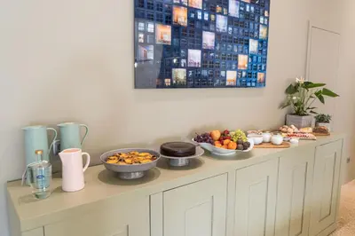 a table with bowls of food on top of it at D'Autor Apartments Alegria in Porto
