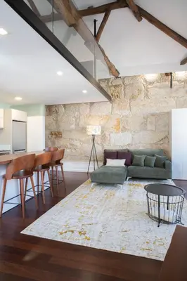a living room with a couch and a table at D'Autor Apartments Alegria in Porto
