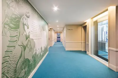 a hallway with a mural of a horse on the wall at Acta The Avenue in Porto