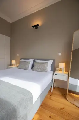 a living room with a couch and a table at MyStay Porto - Urban Collection in Porto