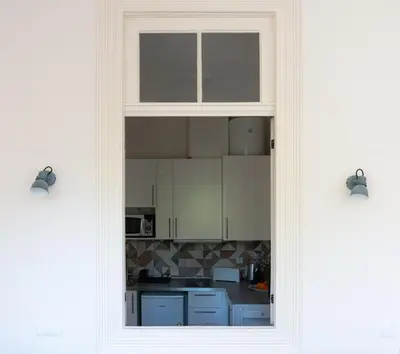 a view of a kitchen through a window at Jardim de São Lázaro - Porto Apartments in Porto