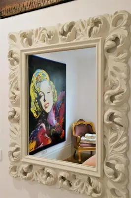 a painting of a woman in a mirror at Spacious Apartment in Porto with Terrace in Porto