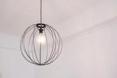 a glass orb chandelier hanging from a ceiling at GuestReady - Music Flats 2 in Porto
