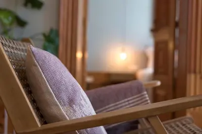 a close up of a wooden chair in a room at Cardosas Palace Apartment in Porto