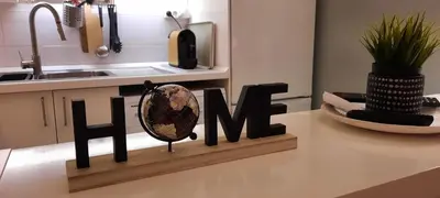 a kitchen with a sign that says hate on a counter at Downtown Porto Spot - 2 bedroom Apartment in Porto