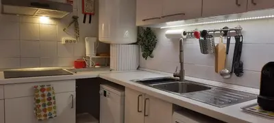a kitchen with a sink and a counter top at Downtown Porto Spot - 2 bedroom Apartment in Porto