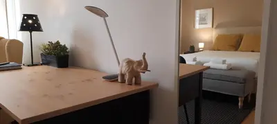 a room with a desk with a toy elephant on it at Downtown Porto Spot - 2 bedroom Apartment in Porto