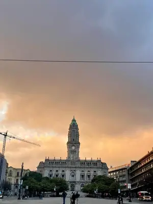a building with a clock tower on top of it at ZD Moreira Flats B By PortoProperties4You in Porto