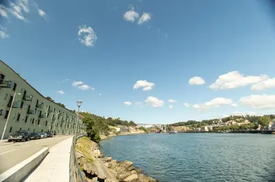 a hallway of an office building with a long corridor at Douro Destilaria Residence by Porto City Hosts in Vila Nova de Gaia