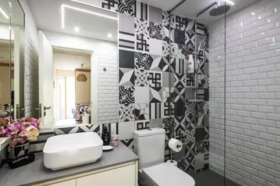 a bathroom with a toilet and a sink and a mirror at Porto Insight Apartments Campanhã in Porto