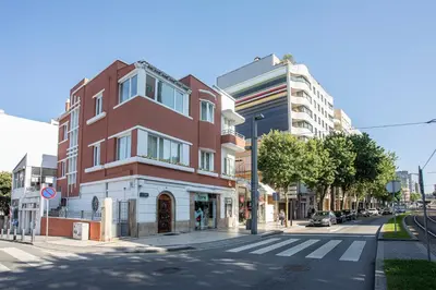 a street with a building on the side of the road at Je T'aime Porto Sweet Rooms in Vila Nova de Gaia
