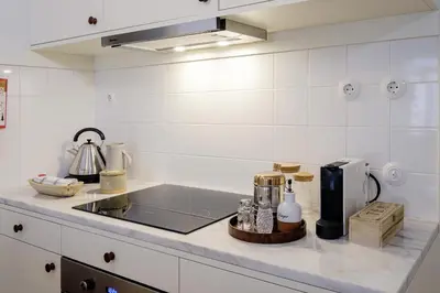 a kitchen with a sink and a counter top at BOUTIQUE Rentals-Flores Plaza in city historical center in Porto