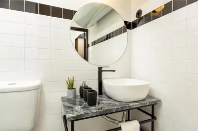 a bathroom with a sink and a mirror at YOUROPO - Santa Catarina in Porto
