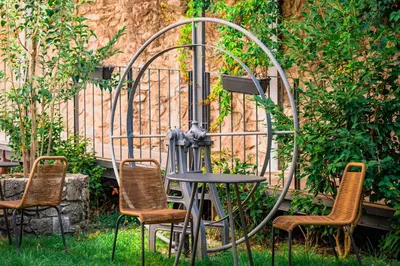 an outdoor balcony with a wooden pergola at Jardim da Batalha Boutique Hotel by Shiadu in Porto