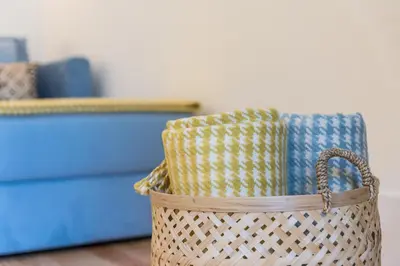 a wicker basket with towels in a room at Porto Belo Sao Bento Apartment in Porto
