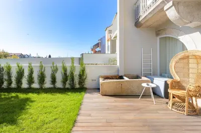 a living room with an open door to a patio at Boavista Garden Studio 183 in Porto