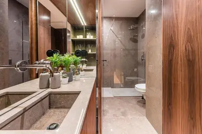 a bathroom with a sink and a toilet and a shower at GuestReady - Grit & Glam in Porto