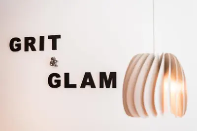 a pendant light with the words gift and a claw at GuestReady - Grit & Glam in Porto
