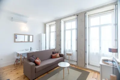 a living room with a couch and a table at Santa Catarina Views by Porto City Hosts in Porto