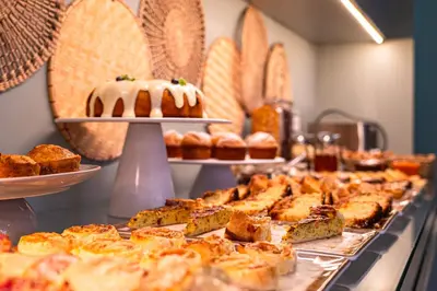 a group of mason jars filled with dessert items at Casa dos Lóios by Shiadu in Porto