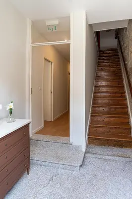 a hallway with a stairway leading to a room at ZD Moreira Flats A By PortoProperties4You in Porto