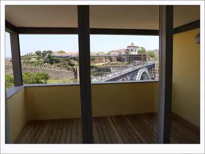 a room with a view of a bridge from a window at Stay In Apartments - D. Hugo 23 in Porto