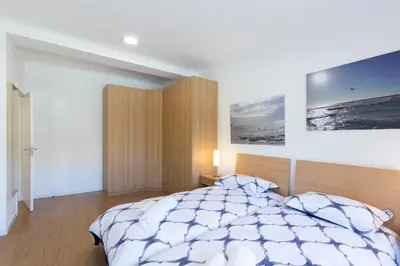 a bedroom with a bed and a picture on the wall at Host Wise - Annas Flats II in Vila Nova de Gaia