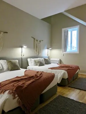 a bedroom with two beds and a window at Oporto Serviced Apartments - Miragaia in Porto