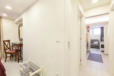 a hallway leading to a living room and a dining room at D&S - Torne Apartments in Vila Nova de Gaia