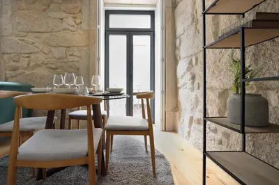 a dining room with a table and chairs at HM - Pinheiro Downtown Living in Porto
