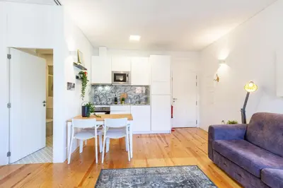 a living room with a couch and a table at D&S - Porto São Bento Apartments III in Porto