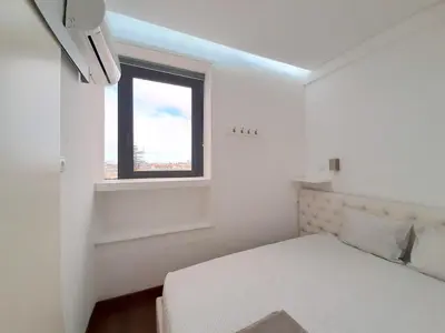 a white room with a bed and a window at VB Porto City Apartment by Flat in Porto in Porto