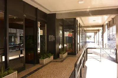 a hallway of a building with plants on the sidewalk at VB Porto City Apartment by Flat in Porto in Porto