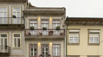 a bedroom with two pictures on the wall at Wonderful Porto Design Apartments in Porto