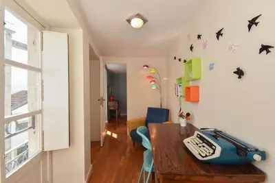 a room with a table with a keyboard on it at Vitoria Apartments in Porto