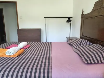 a bed with two towels and two pillows on it at DISCOVER PORTO - Boavista in Porto