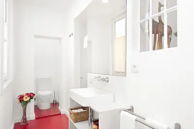 a white bathroom with a sink and a toilet at Host Wise - Oporto Classic Apartment in Porto