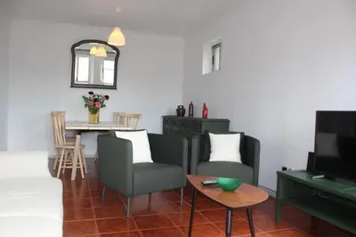 a living room with a couch and a table at Pilar home in Vila Nova de Gaia